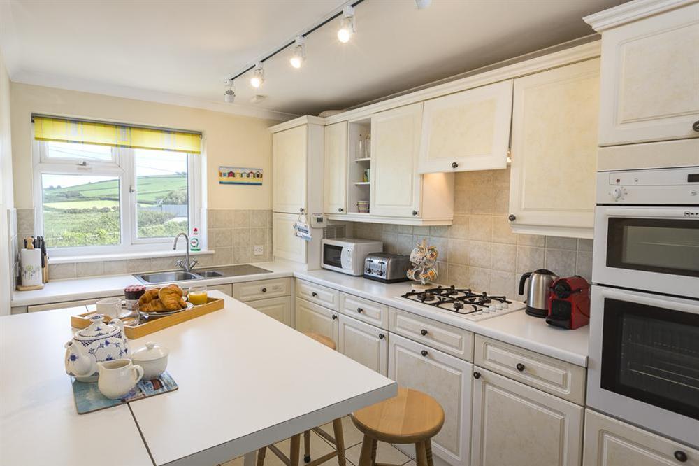 Kitchen with breakfast bar and stools at 3 Thurlestone Rock Apartments in Thurlestone, Kingsbridge