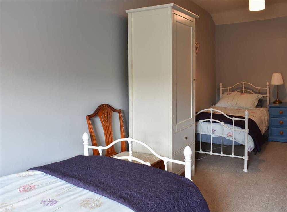 Bedroom with two single beds at 3 Winville Mews in Askrigg, near Hawes, North Yorkshire