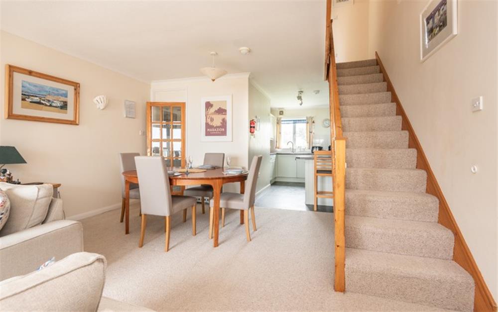 The dining area is between the kitchen and the lounge at 30 Lower Stables in Maenporth