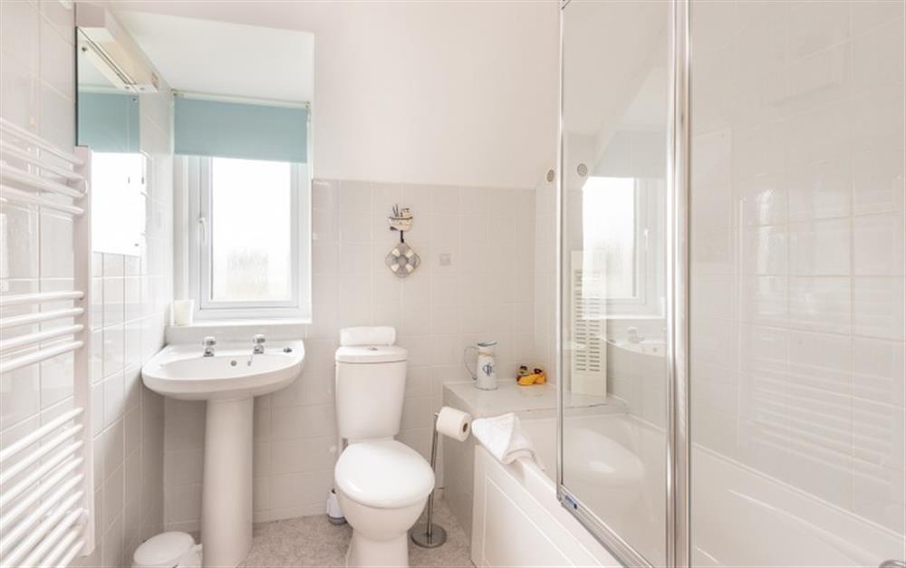 The family bathroom benefits from an additional shower over the bath. at 30 Lower Stables in Maenporth