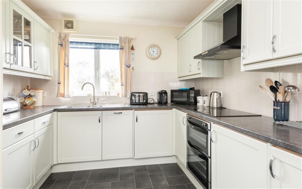 The modern kitchen has plenty of cupboard space. at 30 Lower Stables in Maenporth