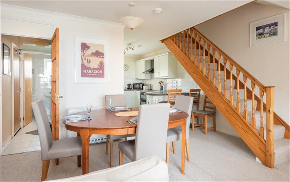 The staircase from the lounge leads to the two bedroom and family bathroom at 30 Lower Stables in Maenporth