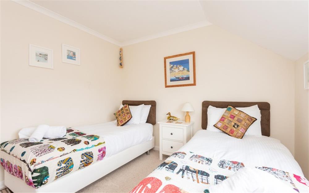 There are some nice pictures throughout the property including the twin bedroom at 30 Lower Stables in Maenporth
