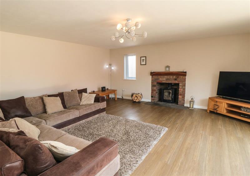 Relax in the living area at 31A The Green, Scalby
