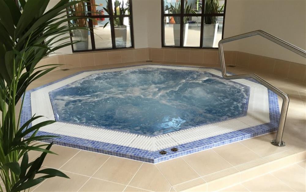 Relax in the Jacuzzi by the pool at 33 Lower Stables in Maenporth