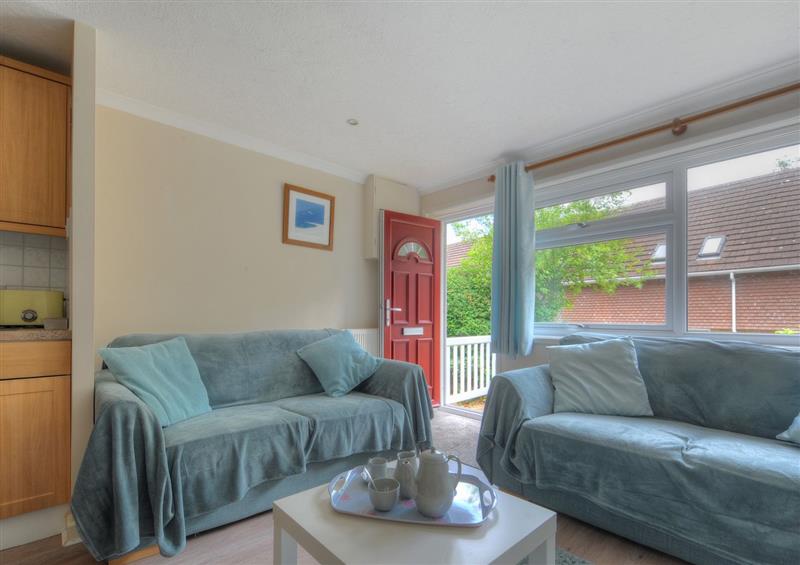 Relax in the living area at 36 Fernhill Heights, Charmouth