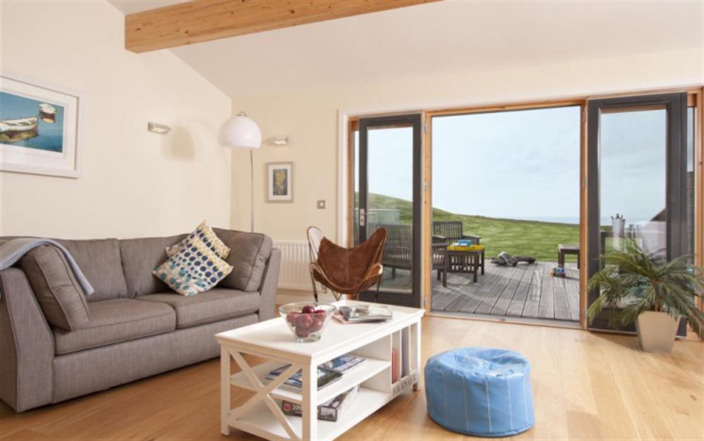 The modern living room where those sea views can be enjoyed at 36 Talland in Talland Bay