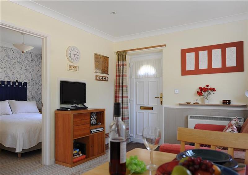 Relax in the living area at 39 Fernhill Heights, Charmouth