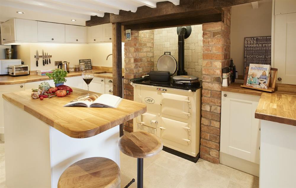 Lower ground floor:  Cosy kitchen with Aga and central island at 39 Foxtail Cottage, Blockley