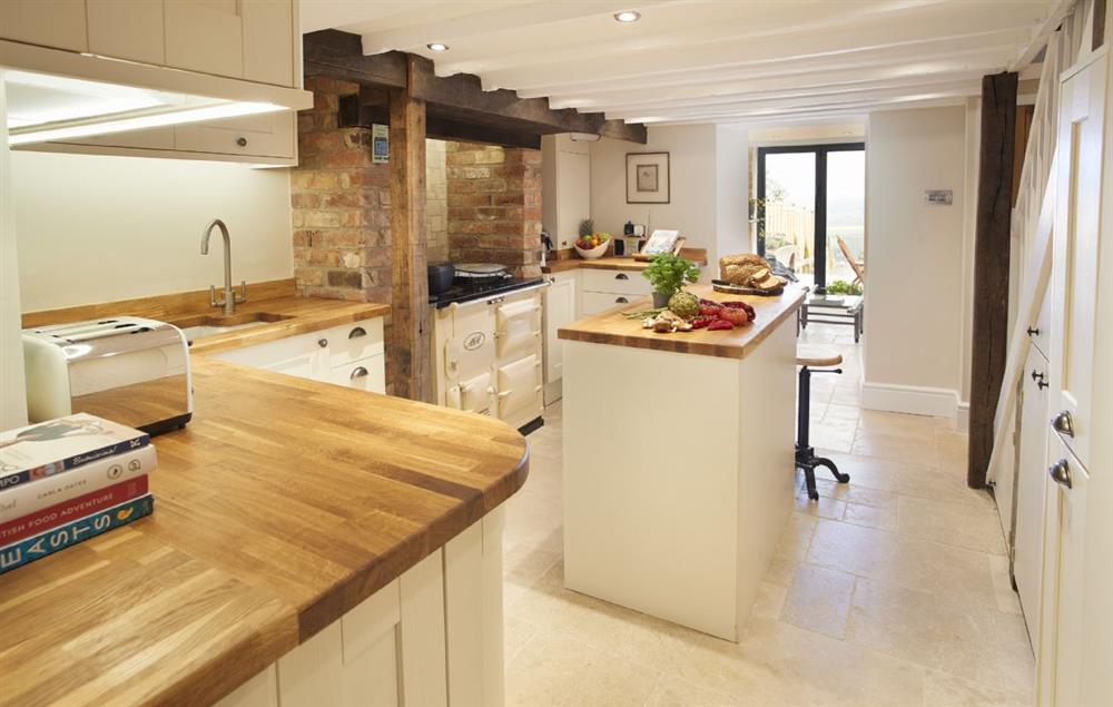 Lower ground floor:  The kitchen flows through to the light and airy garden room at 39 Foxtail Cottage, Blockley
