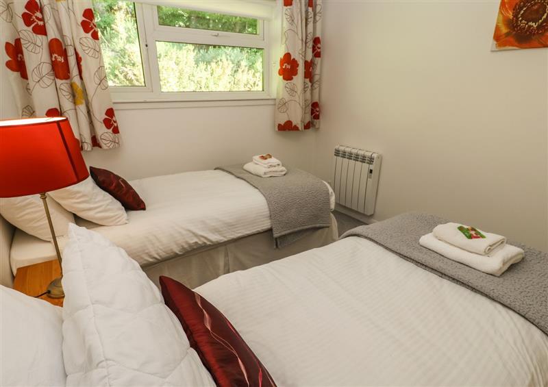 A bedroom in 39 Manorcombe Bungalows (photo 3) at 39 Manorcombe Bungalows, Honicombe Holiday Village near Drakewalls
