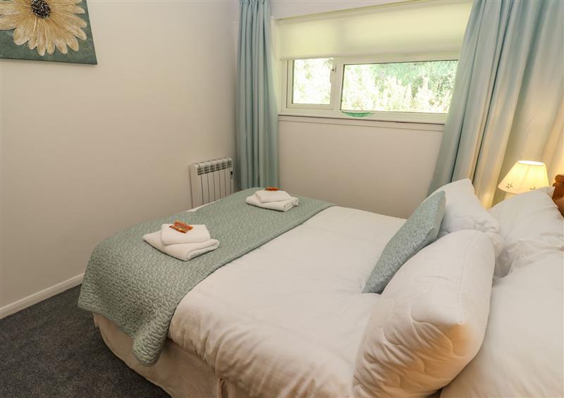 A bedroom in 39 Manorcombe Bungalows at 39 Manorcombe Bungalows, Honicombe Holiday Village near Drakewalls