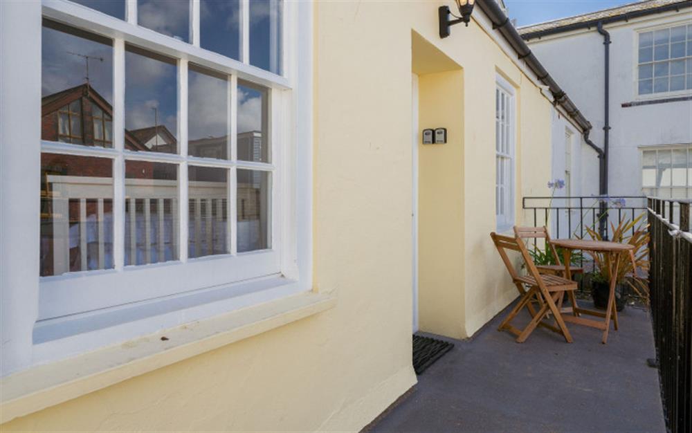 The walkway and small seating area by the property entrance at 3A Island Terrace in Salcombe