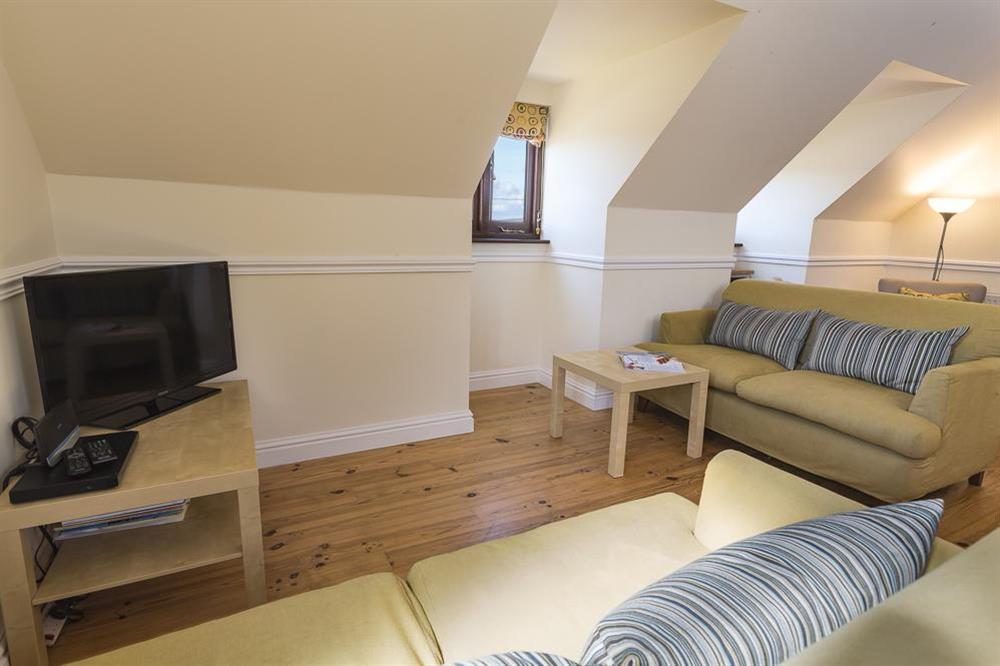 The sitting area features two South West facing dormer windows at 4 Armada Apartments in Hope Cove, Kingsbridge