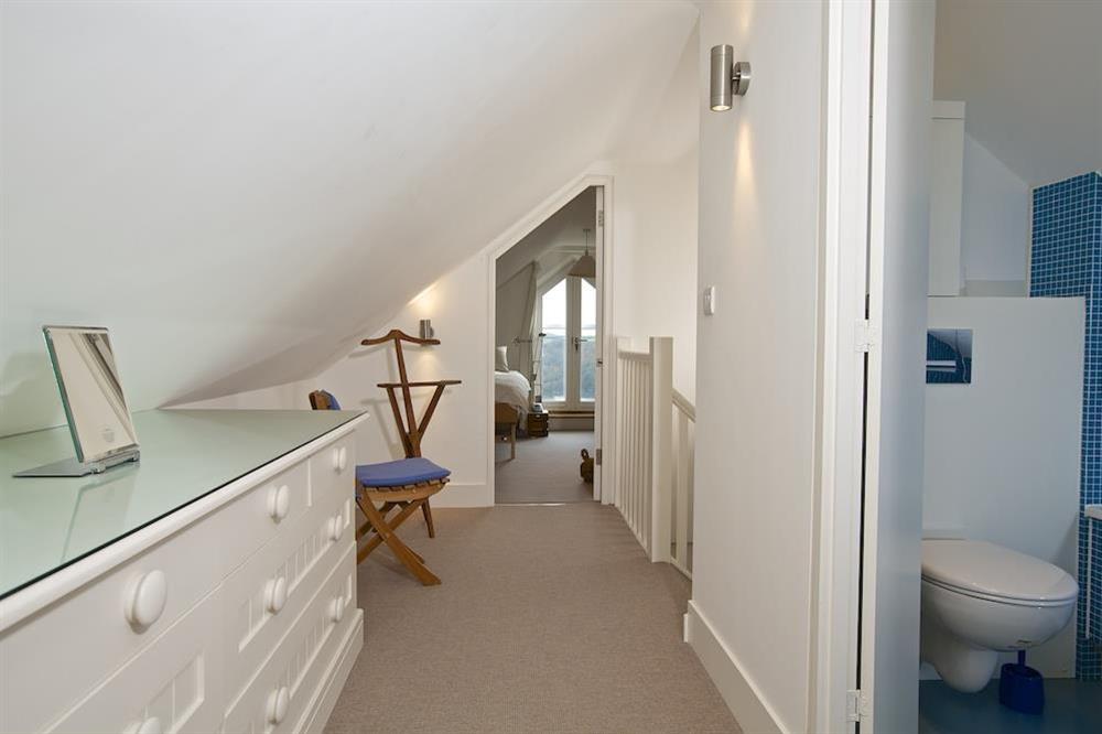 First floor landing with hand-crafted drawers and access to bathroom at 4 Blue View in , Salcombe