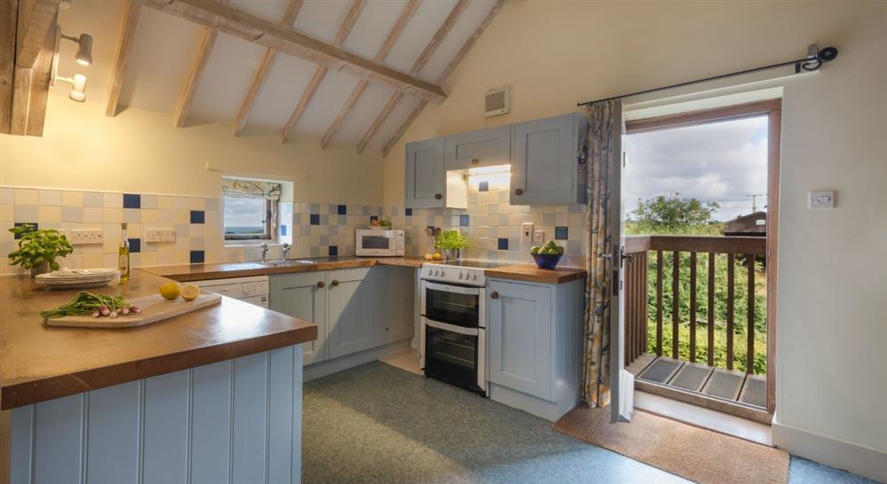 The country kitchen at 4 Cart Lodge Barn in Upper Sheringham, Norfolk
