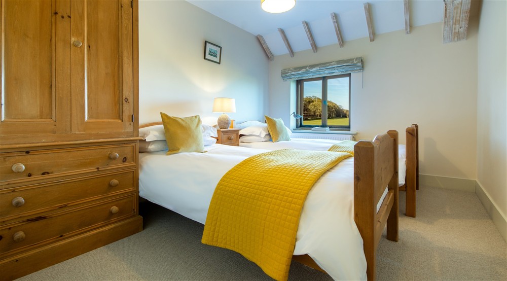 The first twin bedroom at 4 Cart Lodge Barn in Upper Sheringham, Norfolk