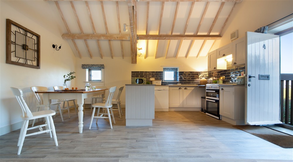 The open-plan kitchen, dining and sitting room (photo 2) at 4 Cart Lodge Barn in Upper Sheringham, Norfolk