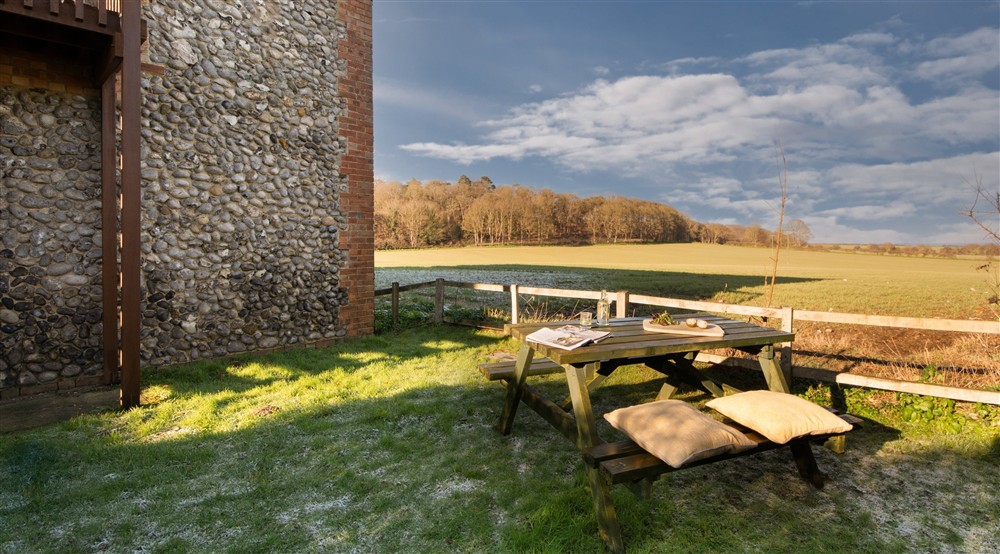 The outdoor seating area at 4 Cart Lodge Barn in Upper Sheringham, Norfolk