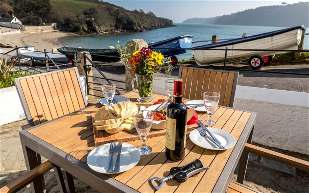 Enjoy al fresco dining with a wonderful river view. at 4 Coastguard Cottage in Helford Passage