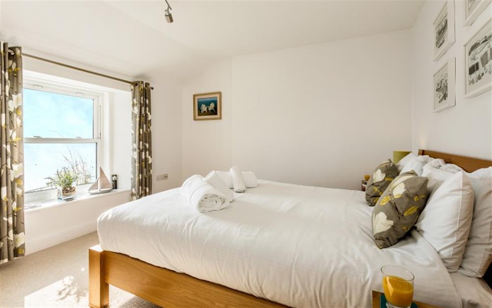 The upstairs master bedroom has fantastic views of the river. at 4 Coastguard Cottage in Helford Passage