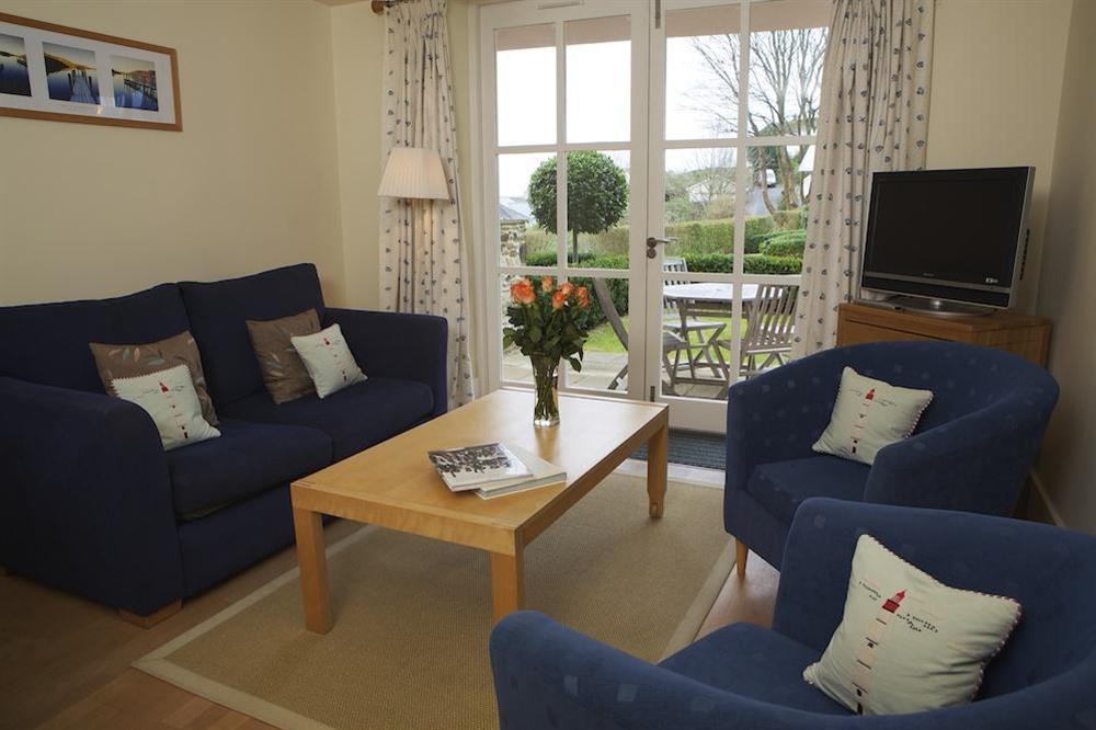 Lounge area with doors opening onto the terrace and garden at 4 Combehaven in , Salcombe
