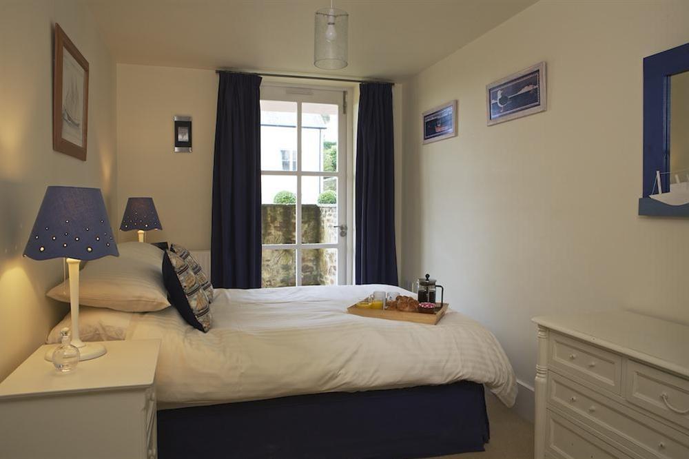 Master bedroom with double bed at 4 Combehaven in , Salcombe