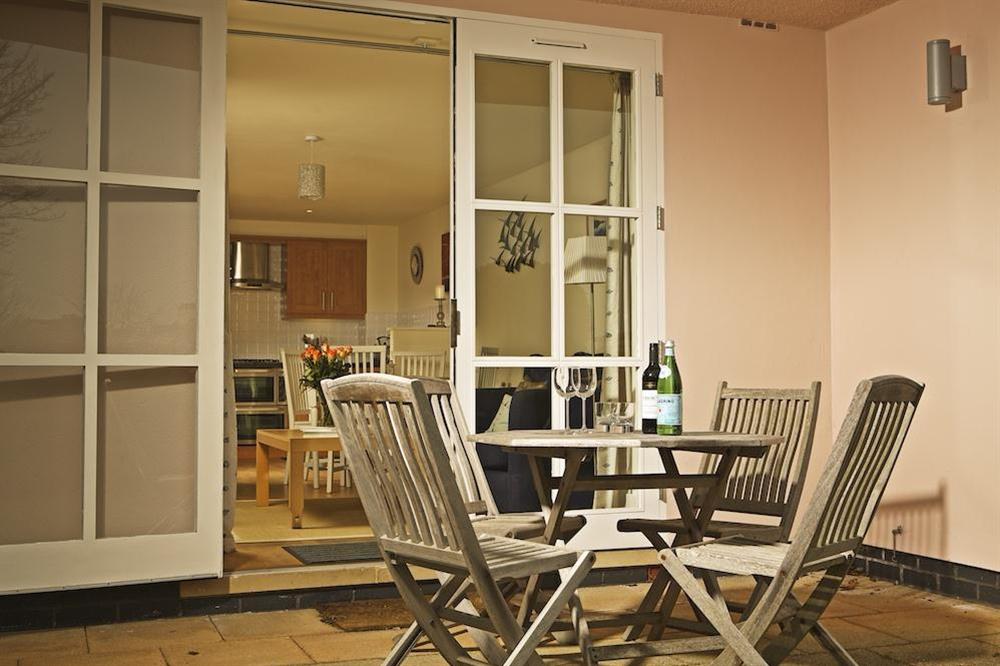 South-facing terrace with table and chairs at 4 Combehaven in , Salcombe