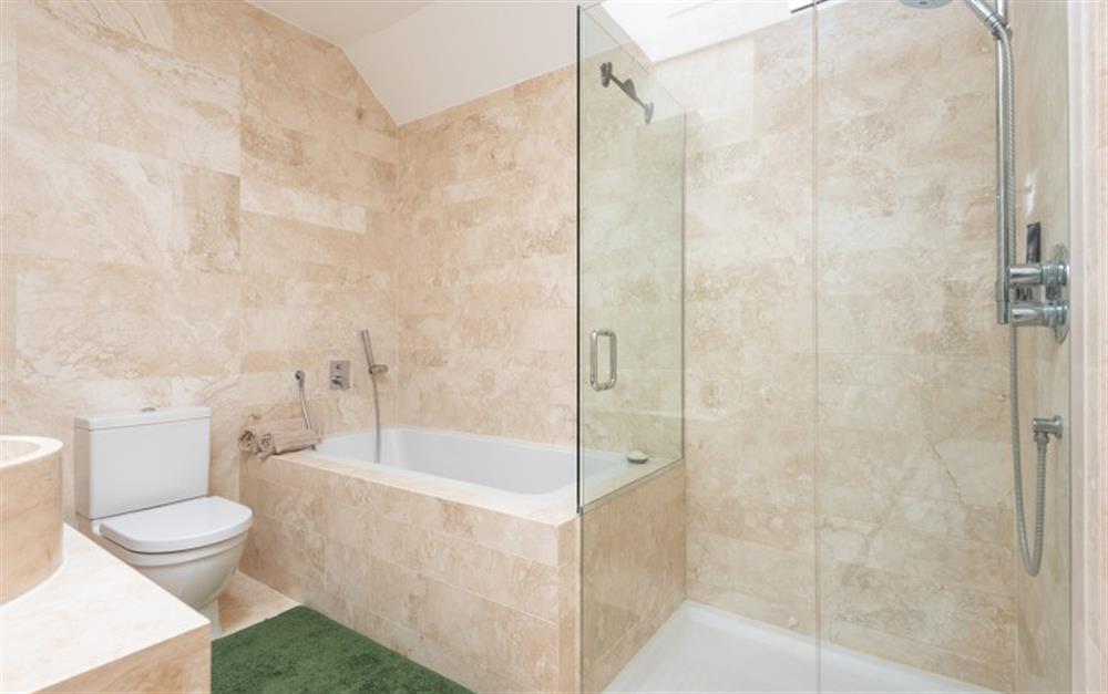 Master bedroom ensuite with bath and separate walk-in shower. at 4 De Challon in East Allington