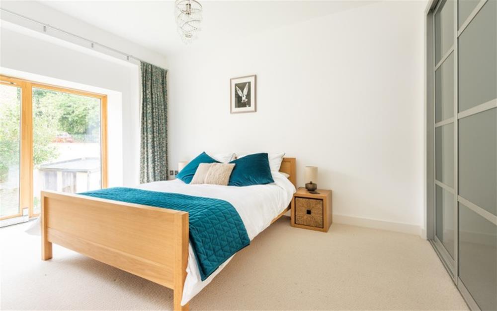 Master bedroom with king size bed and built-in wardrobes. at 4 De Challon in East Allington
