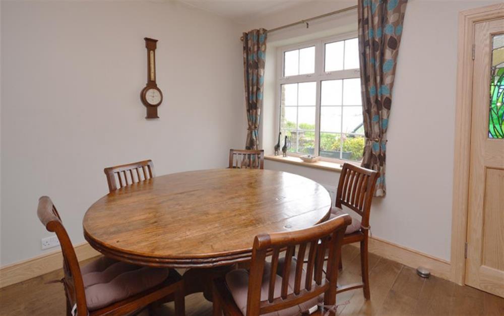 The beautiful dining table with views of the Ley at 4 Florence Cottages in Torcross