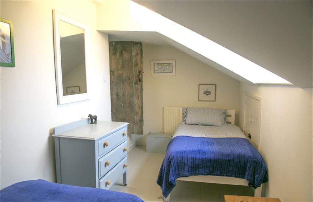 First floor: Bedroom two, with full size twin beds at 4 Gravel Hill, Burnham Overy Town near Kings Lynn