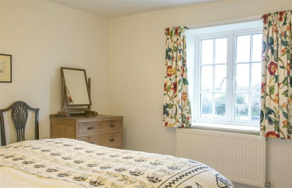 First floor: Master bedroom overlooks farmyard and pretty countryside beyond at 4 Gravel Hill, Burnham Overy Town near Kings Lynn
