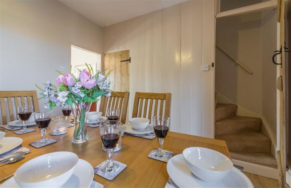 Ground floor: Dining room with stairs to first floor at 4 Harbour View, Brancaster Staithe near Kings Lynn