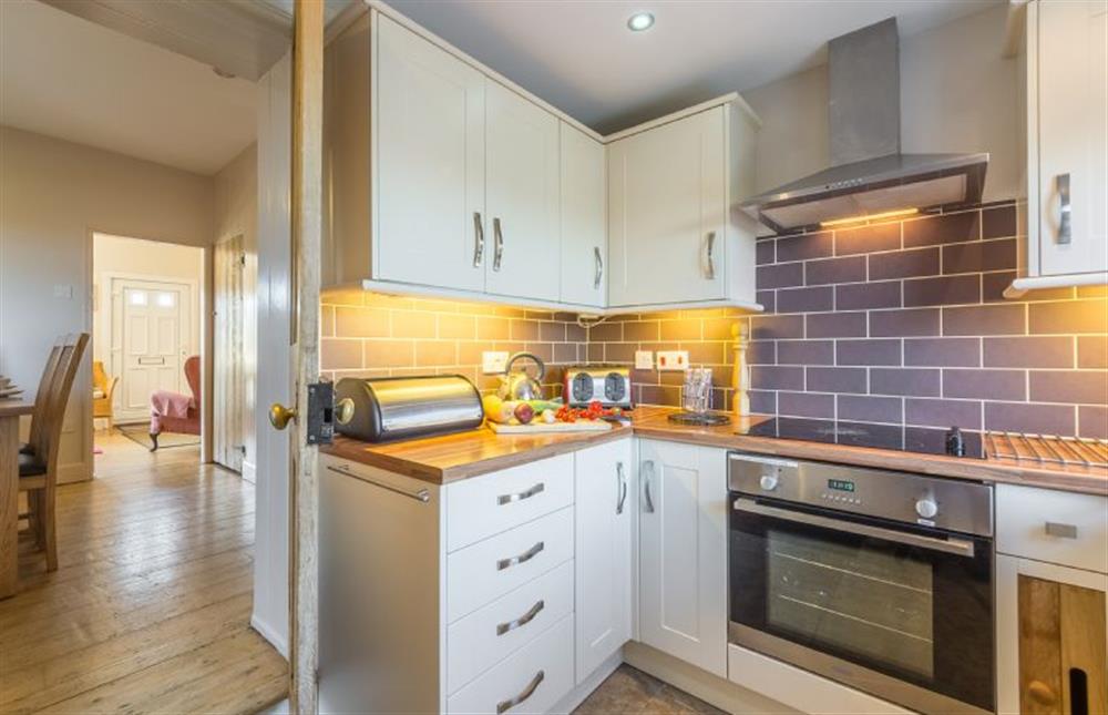 Ground floor: Kitchen, leading to Dining room and Sitting room at 4 Harbour View, Brancaster Staithe near Kings Lynn