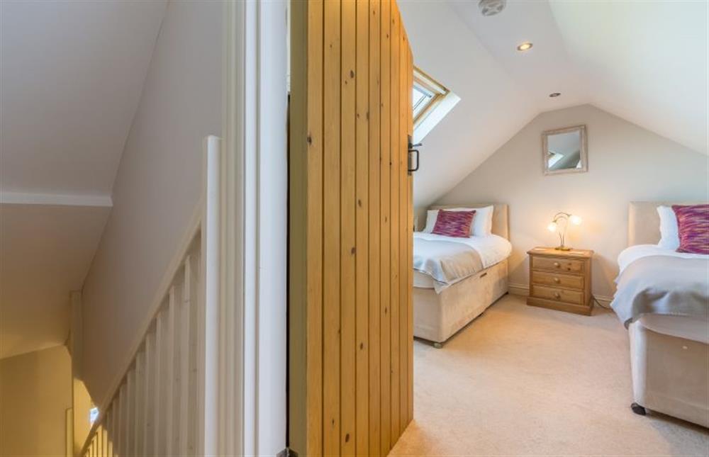 Second floor: Bedroom Three, twin room and stairs at 4 Harbour View, Brancaster Staithe near Kings Lynn