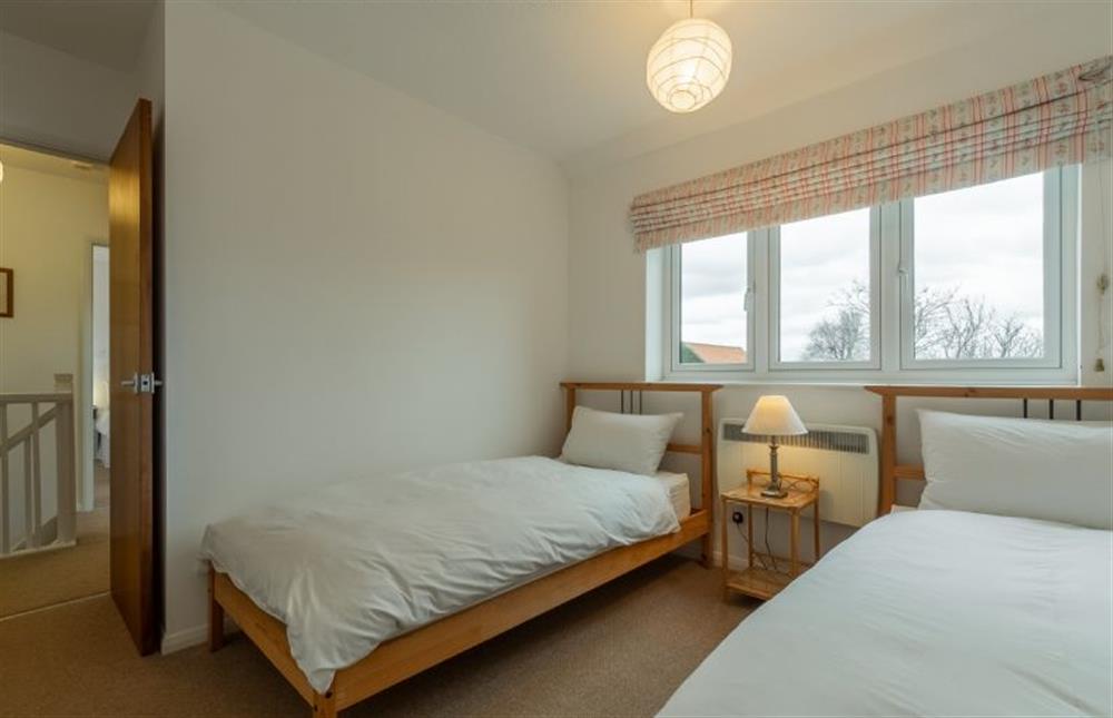 First floor: Bedroom three overlooks the garden and fields beyond at 4 Langford Cottages, Ringstead near Hunstanton