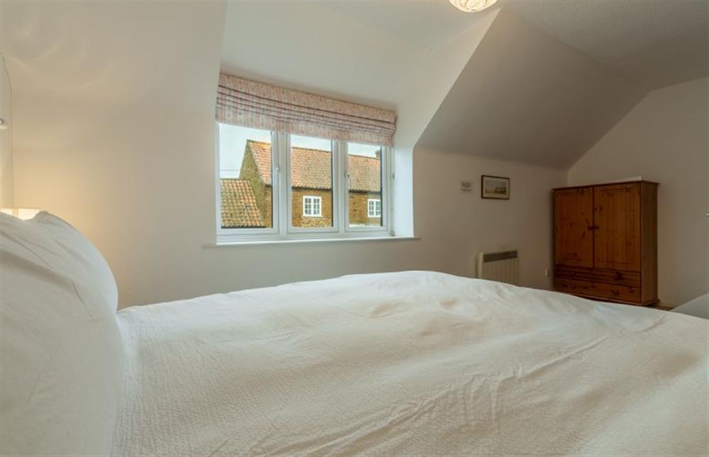 First floor: Comfortable master bedroom at 4 Langford Cottages, Ringstead near Hunstanton