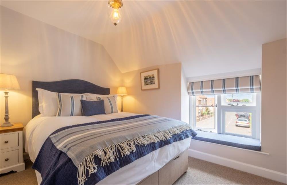 First floor: Bedroom two with king-size bed at 4 Malthouse Cottages, Thornham near Hunstanton