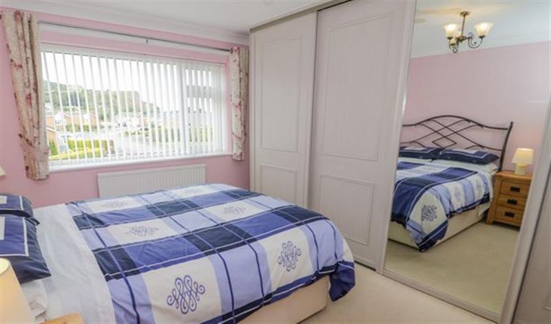 This is a bedroom at 4 Penrhyn Beach East, Penrhyn Bay