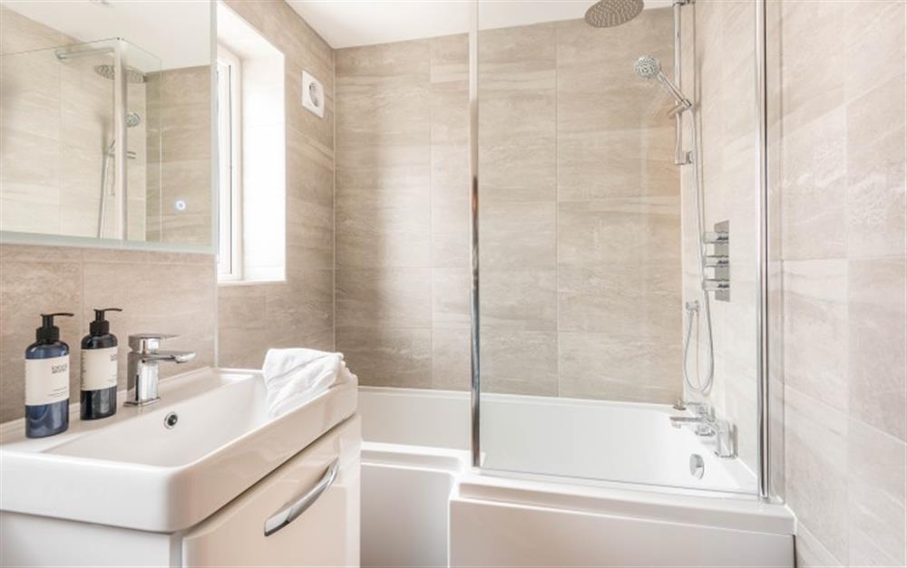 Family Bathroom with over bath shower at 4 Red Sails in Sandbanks