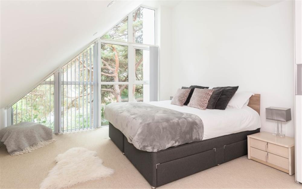 Third Floor Bedroom with front aspect with en-suite at 4 Red Sails in Sandbanks