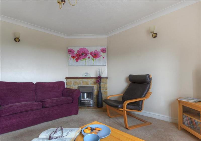Relax in the living area at 4 Riverside Cottages, Charmouth