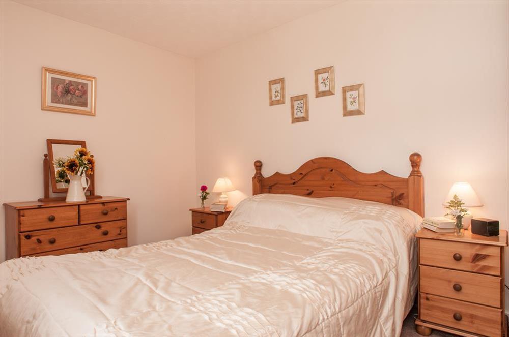 The master bedroom with double bed at 4 Rosemount Court in , Salcombe