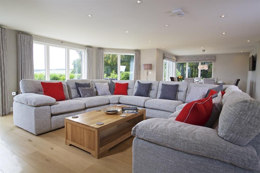 Luxurious, open plan living accommodation with horse-shoe style sofas seating ten (photo 2) at 4 The Drive, Hillfield Village in , Hillfield, Dartmouth