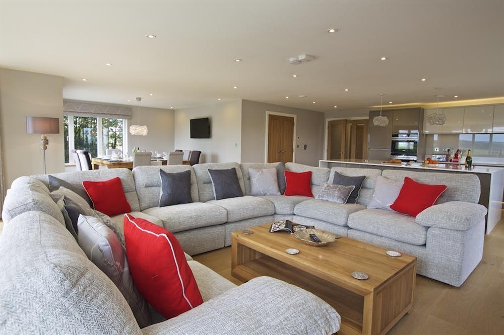 Luxurious, open plan living accommodation with horse-shoe style sofas seating ten at 4 The Drive, Hillfield Village in , Hillfield, Dartmouth