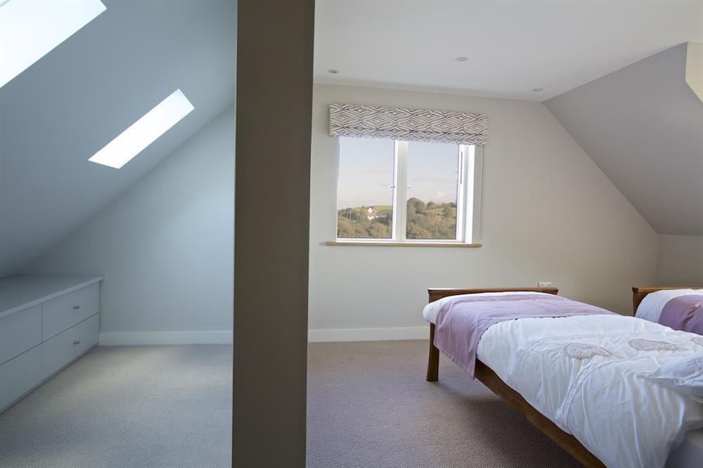 Twin bedroom on the top floor with separate dressing area (behind dividing wall) at 4 The Drive, Hillfield Village in , Hillfield, Dartmouth