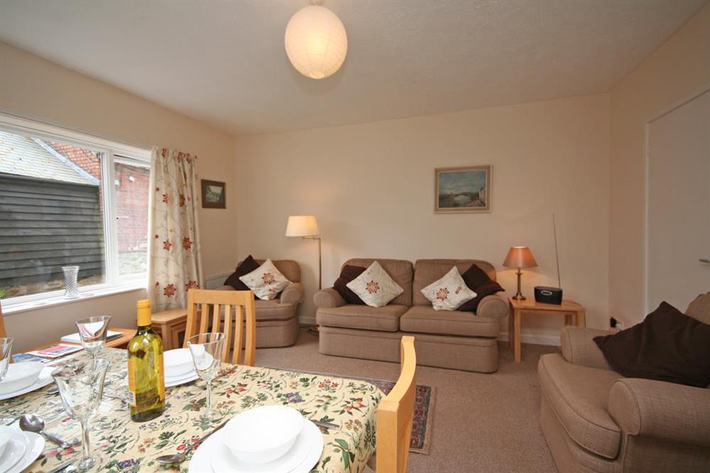 Comfortable open plan lounge and dining area at 4 Waters Edge in Thorning Street, Salcombe