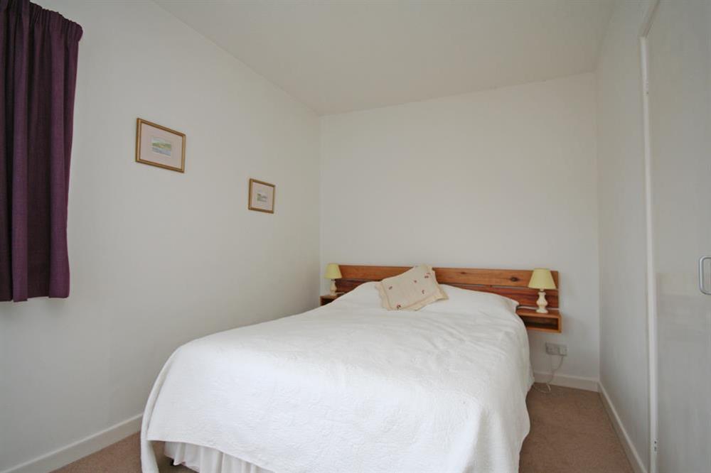 Master bedroom with double bed at 4 Waters Edge in Thorning Street, Salcombe