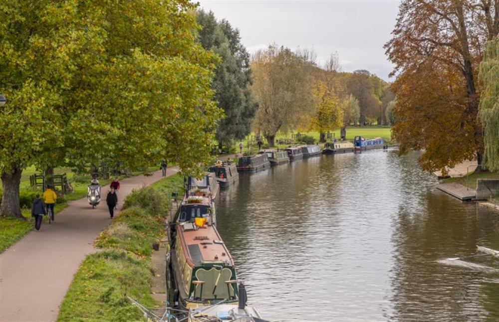 Narrow boats line the River Cam beside Midsummer Common